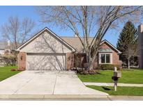 Charming single-Gathering home with a well-maintained lawn and a two-car garage at 2056 Suda Dr, Carmel, IN 46280