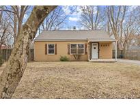 Charming single-story home featuring a cozy front porch and traditional architectural details at 2253 W Coil St, Indianapolis, IN 46260