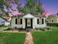 Charming home with a well-manicured lawn and cozy curb appeal at 3926 Delaware St, Anderson, IN 46013