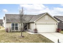 Charming single-story home featuring neutral siding, a two-car garage, and a well-maintained front yard at 4829 Penoyer Ln, Indianapolis, IN 46235