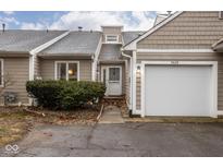 Charming condo with attached one-car garage and well-maintained landscaping at 5629 Crittenden Ave, Indianapolis, IN 46220