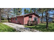 Charming single-story home with a quaint front porch and a well-maintained gravel driveway at 6954 E County Road 100 S, Avon, IN 46123