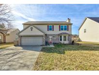 Traditional two-story home featuring a bay window and attached two-car garage at 917 Claiborne Ln, Lebanon, IN 46052