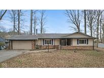 Charming one-story ranch-style home with brick accents and a well-maintained front yard at 2165 Plantation Ln, Martinsville, IN 46151