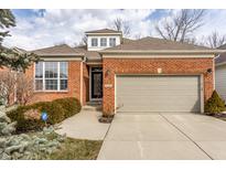 Charming brick home with a well-maintained lawn and attached two car garage, promising curb appeal at 3560 Cardinal Way, Carmel, IN 46074