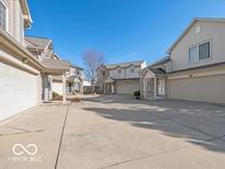 Spacious townhouse community features attached garages and plenty of parking space at 540 Scotch Pine Dr, Greenwood, IN 46143