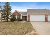 Charming brick home with a well-maintained lawn and attached two-car garage at 6127 Crystal View Dr, Indianapolis, IN 46237