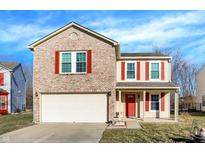 Charming two-story home features a brick facade, red shutters, and a two-car garage at 7939 Crackling Ln, Indianapolis, IN 46259