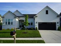 Charming single-Gathering home with a manicured lawn, attached garage, and inviting curb appeal at 804 Whispering Oaks Dr, Carmel, IN 46032