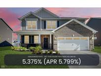 Charming two-story home featuring a brick facade, attached garage, and beautifully landscaped front yard at 9034 Faulkner Dr, Indianapolis, IN 46239