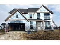 Unfinished two story house, still under construction with visible framework, windows, and a ladder leaning against the side at 1101 Knoll Ct, Greenwood, IN 46143