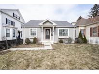 Charming single-story home featuring a welcoming front porch and well-maintained landscaping at 1208 W 8Th St, Anderson, IN 46016