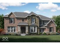 Beautiful two story home featuring a stone and brick facade, well manicured yard and shutters at 1558 Old Hickory Ln, Westfield, IN 46074