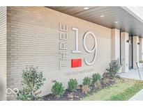 Attractive condo building exterior with brickwork and modern signage at 319 E 16Th E St # 201, Indianapolis, IN 46202
