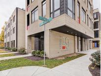 Modern building exterior showcasing brick facade and architectural details at 'The 19 The Old Northside' at 319 E 16Th St # 302, Indianapolis, IN 46202