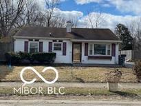 Quaint single-story home features a cozy design and landscaped yard at 4111 Kalmar Dr, Indianapolis, IN 46222