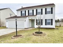 Charming two-story home with white siding, black shutters, and a well-manicured front yard at 6251 Kelsey Dr, Indianapolis, IN 46268