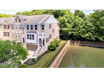 Beautiful brick townhouse with a river view and small balcony at 651 Greenford N Trl, Carmel, IN 46032
