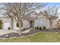 Charming brick home with well-maintained landscaping and a two-car garage at 10140 Cheswick Ln, Fishers, IN 46037