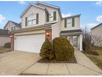 Charming two-story home with a two-car garage and well-maintained landscaping at 11610 Signet Ln, Indianapolis, IN 46235