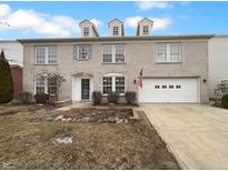 Charming two-story home featuring a brick facade, dormer windows, and a well-maintained front yard at 255 Legacy Blvd, Greenwood, IN 46143