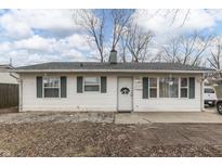 Charming single-story home with white siding, green shutters, and a welcoming front door at 2619 Falcon Dr, Indianapolis, IN 46222