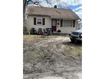 Charming one-story home with red shutters, a red front door, and a well-kept yard at 1105 N Livingston Ave, Indianapolis, IN 46222