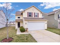 Inviting two-story home with a two-car garage and well-maintained front lawn in a Gathering-friendly neighborhood at 11430 Congaree Way, Indianapolis, IN 46235