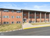 Charming brick apartment building with well-maintained landscaping and classic architectural details at 5034 Allisonville Rd # A, Indianapolis, IN 46205