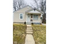 Charming single-story home featuring neutral siding, a covered front porch, and a well-maintained lawn at 620 W Madison St, Alexandria, IN 46001