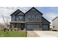 Beautiful two-story home with gray siding, black trim, and a spacious two-car garage at 7214 Barrett Dr, Brownsburg, IN 46112