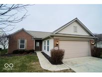 Charming single Gathering home with a manicured lawn, two-car garage, and brick facade at 12922 Oxbridge Pl, Fishers, IN 46037