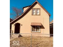 Charming two-story home featuring a quaint entrance and a classic architectural design at 2842 Indianapolis Ave, Indianapolis, IN 46208