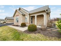 Charming condo featuring stone accents, manicured landscaping, and inviting curb appeal at 112 Bridgemor Ln, Mooresville, IN 46158