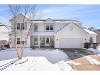 Charming two-story home featuring a two-car garage and a welcoming front porch at 11835 Bengals Dr, Fishers, IN 46037