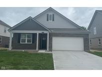 Charming single-Gathering home featuring a two-car garage and a welcoming, covered front porch at 1366 Foxtail Ln, Greenwood, IN 46143