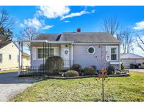 Charming one-story home with a well-manicured lawn and inviting front porch under a beautiful sky at 145 W Old South St, Bargersville, IN 46106