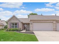 Charming single-story home featuring a well-manicured lawn and attached two-car garage at 1488 Hamilton Dr, Greenwood, IN 46143