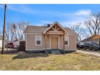 Charming home featuring a welcoming front porch and a well-maintained lawn, providing a cozy curb appeal at 501 S Taft Ave, Indianapolis, IN 46241