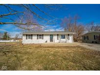 Charming single-story home featuring a well-maintained front yard and inviting entrance with chairs at 540 Barnett Ct, Whiteland, IN 46184