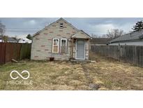 View of home's backyard showcasing the home's exterior and yard at 714 S Biltmore Ave, Indianapolis, IN 46241