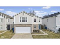 Charming two-story home featuring a two-car garage and well-maintained lawn at 11614 Presidio Dr, Indianapolis, IN 46235