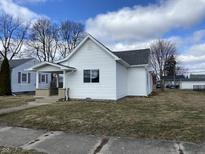 Charming single-story home with white siding, a cozy front porch, and well-maintained landscaping at 2712 S A St, Elwood, IN 46036