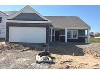 New construction featuring a brick and siding facade, an attached two-car garage and a covered front porch at 3885 Berkdale Ct, Columbus, IN 47203