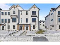 Charming townhouse showcasing a modern exterior with clean lines, enhanced by a well-maintained front yard and inviting entrance at 4180 Douro Trl, Westfield, IN 46062