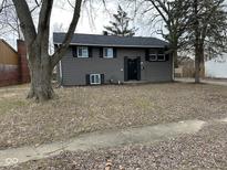 Charming two-story home with a well-maintained front yard and classic architectural details at 7931 Penway St, Indianapolis, IN 46226