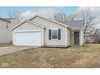 Charming single-story home with vinyl siding, a well-manicured lawn, and an attached one car garage at 13446 N Carwood Ct, Camby, IN 46113