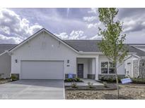 Beautiful new construction home with a white exterior, attached garage, and landscaped front yard at 16799 Imperial Ct, Fishers, IN 46040