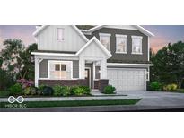 Charming two-story home featuring gray siding, white trim, a brick foundation, and an attached garage at 16942 Sandhurst Pl, Westfield, IN 46074