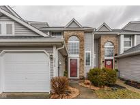 Exterior view of home with attached garage and well-maintained landscaping at 3278 Oceanline E Dr, Indianapolis, IN 46214